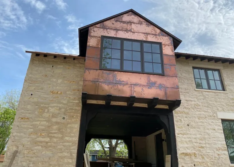 Copper metal panel facade on a stone building for Skylight Installation in East Brandywine